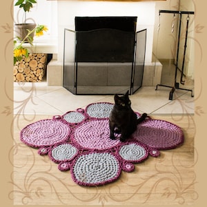 Rug of hand knitted round elements of purple and gray. Knitted rug. Knitted mat. Bathroom mat. Rug for the living room. Crocheted rug.