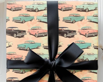 May include: A gift box wrapped in vintage car patterned wrapping paper with a black satin ribbon bow.