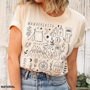 Illustrated adventure t-shirt featuring mountain and camping design, perfect for hikers, nature lovers, and outdoor vacations.