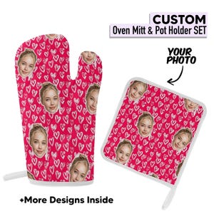 May include: A custom oven mitt and pot holder set. The set features a repeating pattern of white hearts on a pink background, with a photo of a person's face. Text reads "CUSTOM Oven Mitt & Pot Holder SET" and "YOUR PHOTO".