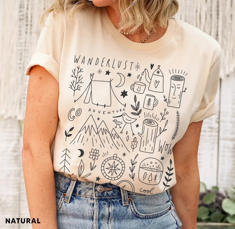 Illustrated adventure t-shirt featuring mountain and camping design, perfect for hikers, nature lovers, and outdoor vacations.