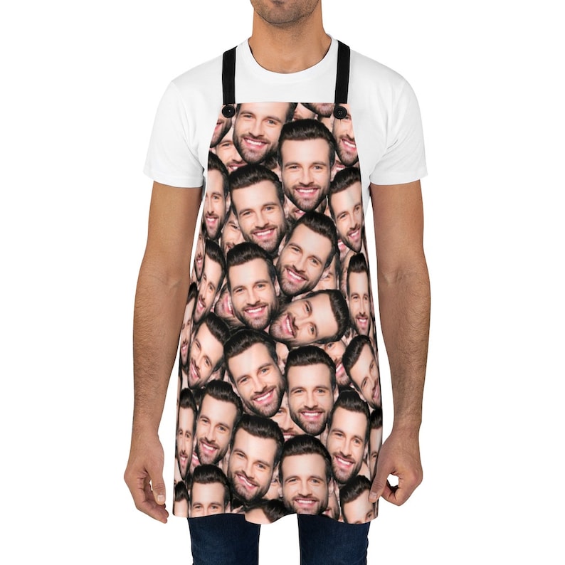 Man wearing a personalized white apron with his dog’s face printed on the front, perfect pet lover gift for grilling and cooking.