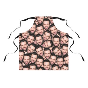 Man wearing a personalized white apron with his dog’s face printed on the front, perfect pet lover gift for grilling and cooking.