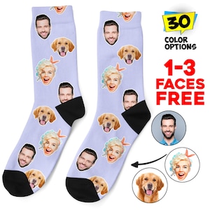 May include: Two light purple socks with black heels and toes. The socks are decorated with various faces, a golden retriever, and a woman with blonde hair. The image also includes text that says "30 COLOR OPTIONS" and "1-3 FACES FREE."