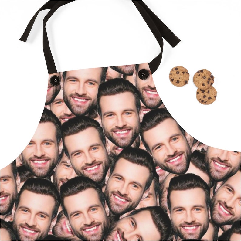 Man wearing a personalized white apron with his dog’s face printed on the front, perfect pet lover gift for grilling and cooking.