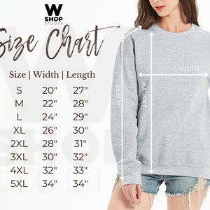 May include: Size chart for a sweatshirt with measurements in inches for width and length. The chart shows sizes from S to 5XL. The sweatshirt is gray and is being worn by a person.