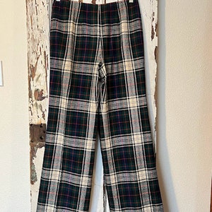 May include: Black, green, and white plaid pants with a wide leg.