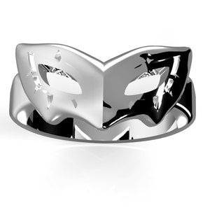 May include: A silver ring featuring a black and white mask design. The mask is a half-mask with a pointed top and a curved bottom. The ring is a simple band with a smooth finish.