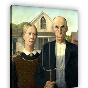 May include: A painting of a couple standing in front of a house. The man is wearing a dark suit, overalls, and a straw hat. He is holding a pitchfork. The woman is wearing a dark dress with a white collar and a white apron. She is holding a basket of flowers. The house is a white farmhouse with a porch and a green roof.