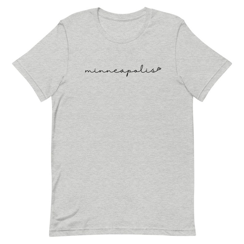May include: A heather gray t-shirt with the word "minneapolis" written in black cursive script.