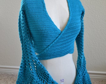 May include: A turquoise blue crocheted wrap top with long bell sleeves. The top is a wrap style with a deep V-neckline. The sleeves are crocheted in a lacy pattern.