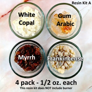 May include: A set of four small glass jars, each containing a different type of resin. The jars are labelled "White Copal", "Gum Arabic", "Myrrh", and "Frankincense". The text "Resin Kit A" and "4 pack - 1/2 oz. each" is also visible. This resin kit does NOT include burner.