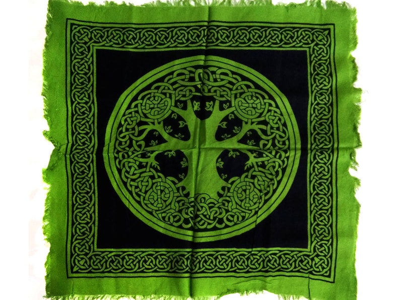 May include: Green tapestry with a black center featuring a Celtic knot design of a tree of life. The tree is surrounded by a circle of knots.
