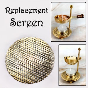 May include: Brass incense burner replacement screen. The screen is round and has a honeycomb pattern. It is designed to fit over a candle holder.
