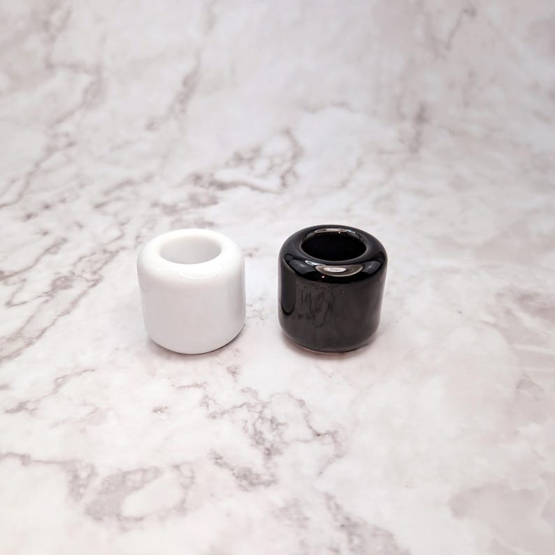 Black and white chime candle holders, for Wiccan rituals