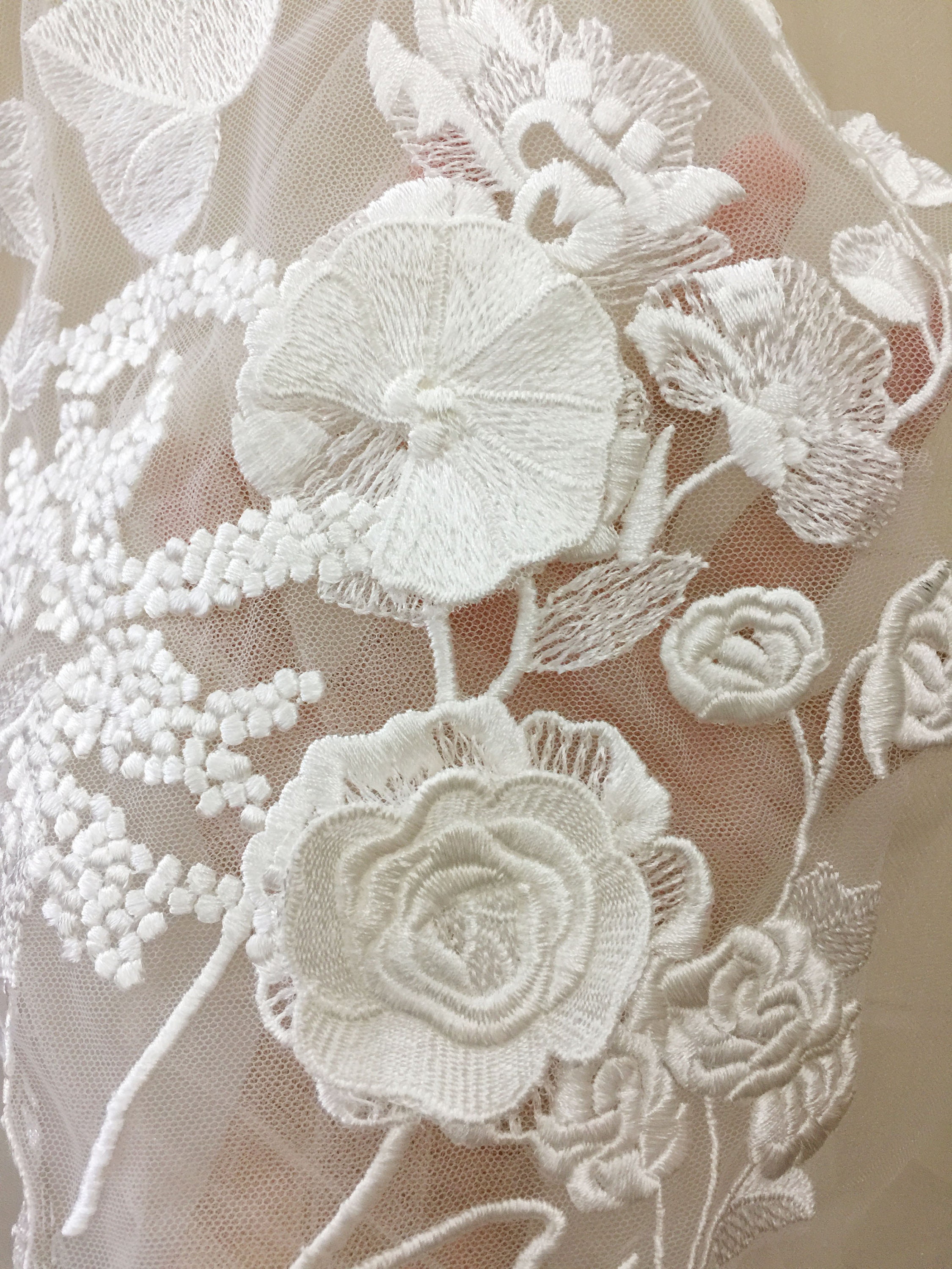 Floral lace appliqué over layered tulle