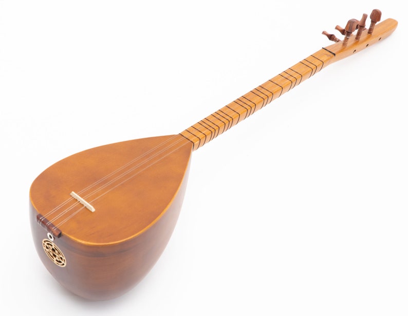 May include: A wooden long-necked stringed instrument, likely a saz or similar folk instrument. The body is a warm brown color, with a pear-shaped soundbox. The neck is long and slender, with frets and tuning pegs. The instrument has three strings and a decorative sound hole.