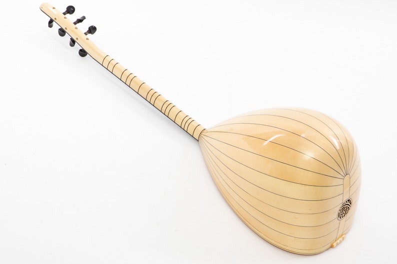 May include: A light wood  saz, a Turkish stringed instrument, with a pear-shaped body and a long neck with tuning pegs. The body is decorated with thin black lines.
