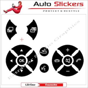 May include: Set of black and white car stereo control stickers. The stickers feature icons for volume, phone, navigation, and other functions. The stickers are designed to fit on a car's steering wheel.