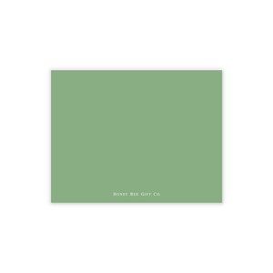 May include: A rectangular card with a solid sage green background. The text "HONEY BEE GIFT CO." is printed in a light color at the bottom of the card. The card is likely used for gifting or stationery.