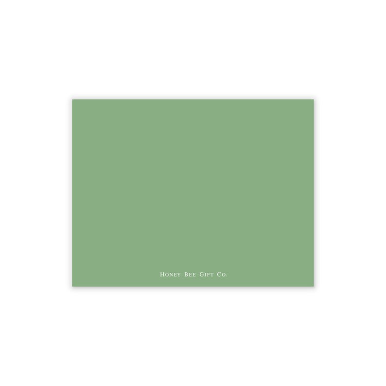 May include: A rectangular card with a solid sage green background. The text "HONEY BEE GIFT CO." is printed in a light color at the bottom of the card. The card is likely used for gifting or stationery.