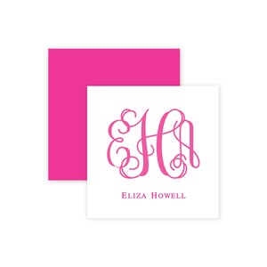 May include: A white card with a hot pink monogram and the name "Eliza Howell" printed in a matching pink font. A hot pink envelope is visible behind the card, creating a layered effect. The monogram features the letters "E" and "H".