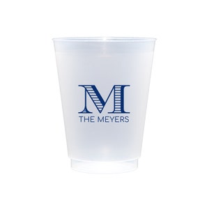 May include: A white frosted plastic cup with a blue monogram "M" and the text "THE MEYERS" printed on the front.