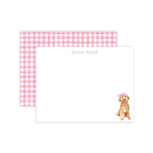 May include: Pink and white gingham stationery with the name "Eloise Smith" printed at the top. A watercolor illustration of a golden doodle dog with a pink bow is at the bottom of the card.