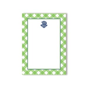 May include: Green and white gingham notepad with a blue monogram in the center. The notepad has a white border.