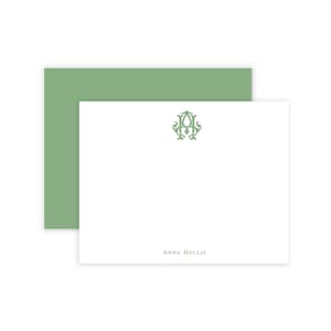 May include: A white stationery set featuring a green monogram and the name "Anna Hollis" printed in a matching green font. The set includes a white card and a green envelope, perfect for personalized correspondence.