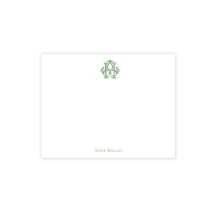 May include: White stationery card with a green monogram in the upper center and the name "ANNA HOLLIS" printed in green at the bottom. The monogram is an ornate design.