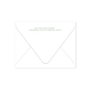 May include: A white envelope with a folded flap, featuring the address "345 West Elm Street, Lexington, South Carolina 29071" in a green, serif font. The envelope is blank, with a simple, clean design.