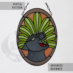 May include: An oval stained glass pattern featuring a black panther head with an open mouth and red tongue, surrounded by a fan of light green leaves. The design includes a brown border, a metal hanging chain, and the text DIGITAL PATTERN and ADVANCED BEGINNER.