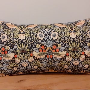 Classic William Morris Indigo Blue Strawberry Thief Cushion Cover with a soft velvet blue back.