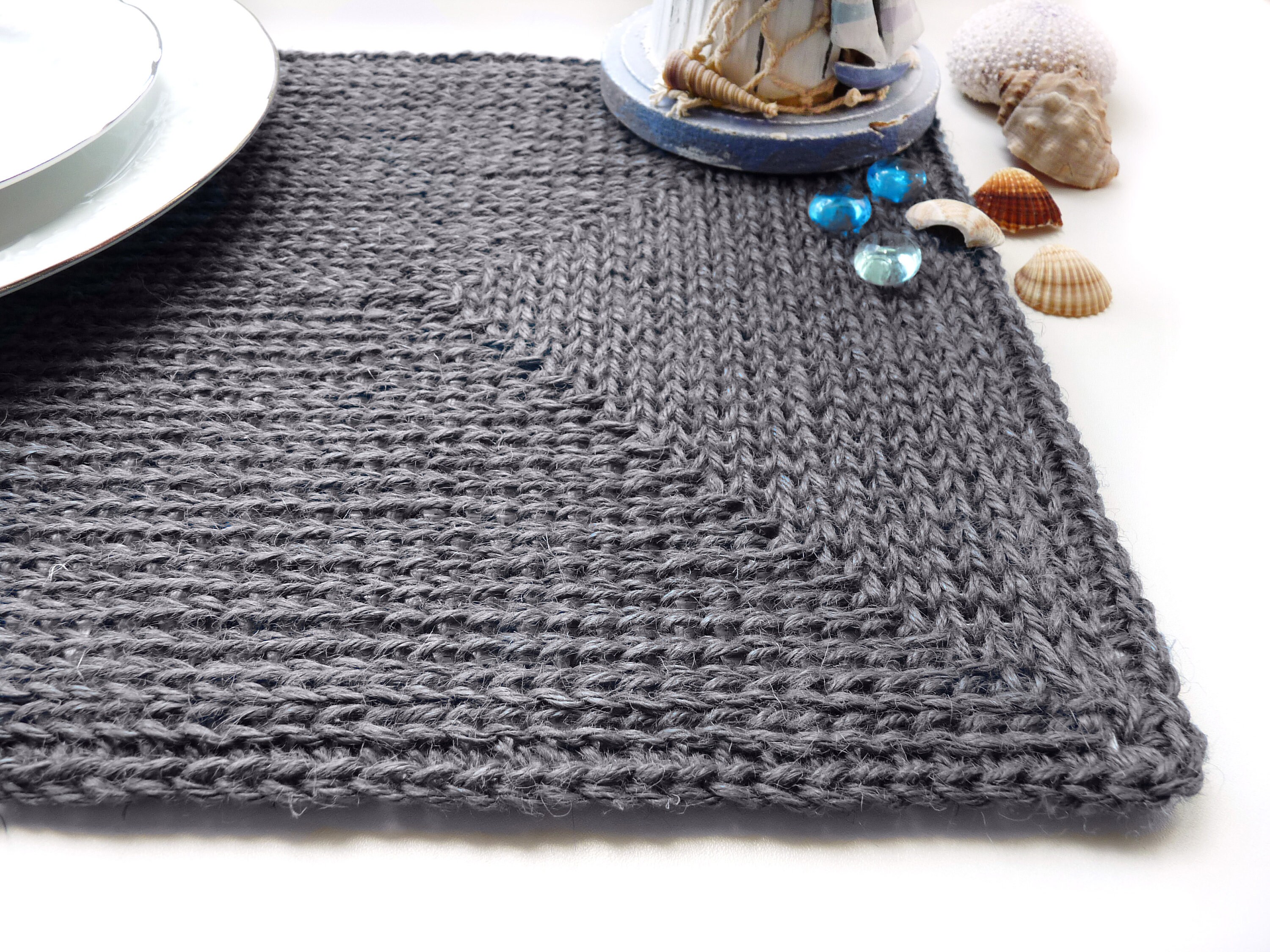 Grey jute rectangular placemat made with a rubber base in a Etsy