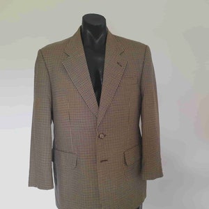May include: A brown and black plaid blazer with two button closures.
