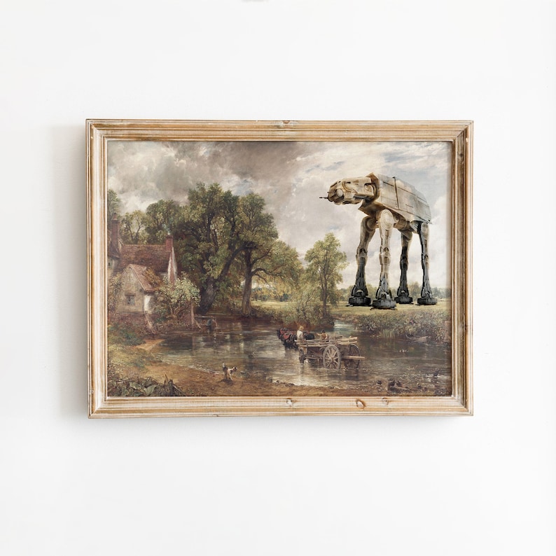 May include: A framed print featuring a classic landscape painting with a Star Wars AT-AT walker superimposed on the scene. The artwork has a vintage aesthetic with a light brown wooden frame.