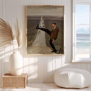 May include: A framed wall art print featuring a surreal composition of a man in a brown suit and white shirt, captured in a dynamic pose with one leg raised, superimposed over a muted landscape painting of a long, straight road stretching into the distance.