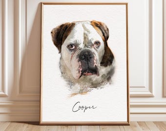 May include: A framed watercolor-style portrait of a bulldog with brown and white fur, featuring a black nose and dark eyes. The dog is centered on a white background with the name Cooper written in black cursive script underneath the illustration.