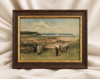 May include: A framed landscape painting depicting a group of people playing golf on a grassy course near a coastal beach. The artwork is enclosed in a dark brown wooden frame with a thin gold inner border, showcasing a scenic outdoor view.