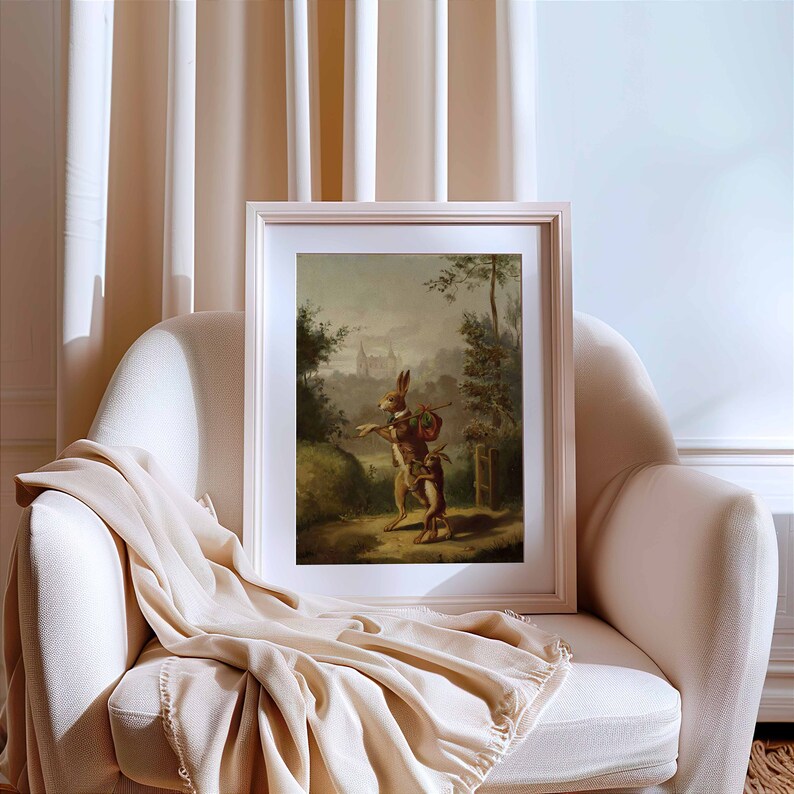 May include: A vintage painting of two rabbits in a forest setting. The rabbit on the left is holding a stick and a bag, while the rabbit on the right is looking at the other rabbit. The painting is framed in a white frame.