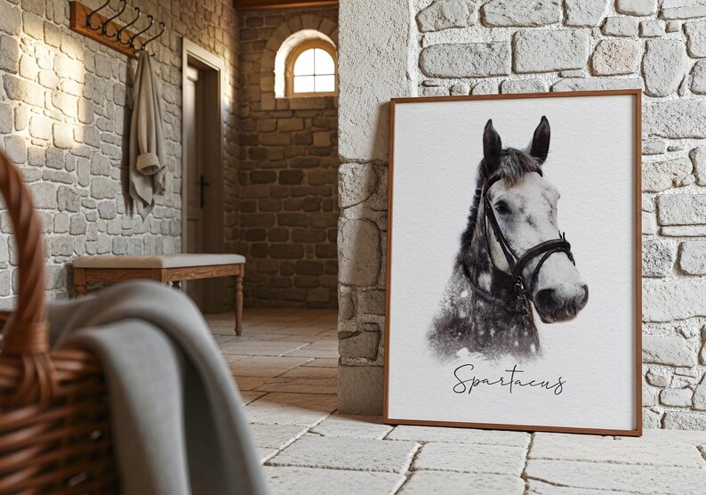 May include: A rectangular framed print featuring a black and white portrait of a horse wearing a bridle. The horse has a light-colored face and a darker neck. Below the horse, the name Spartacus is written in a black cursive script font.