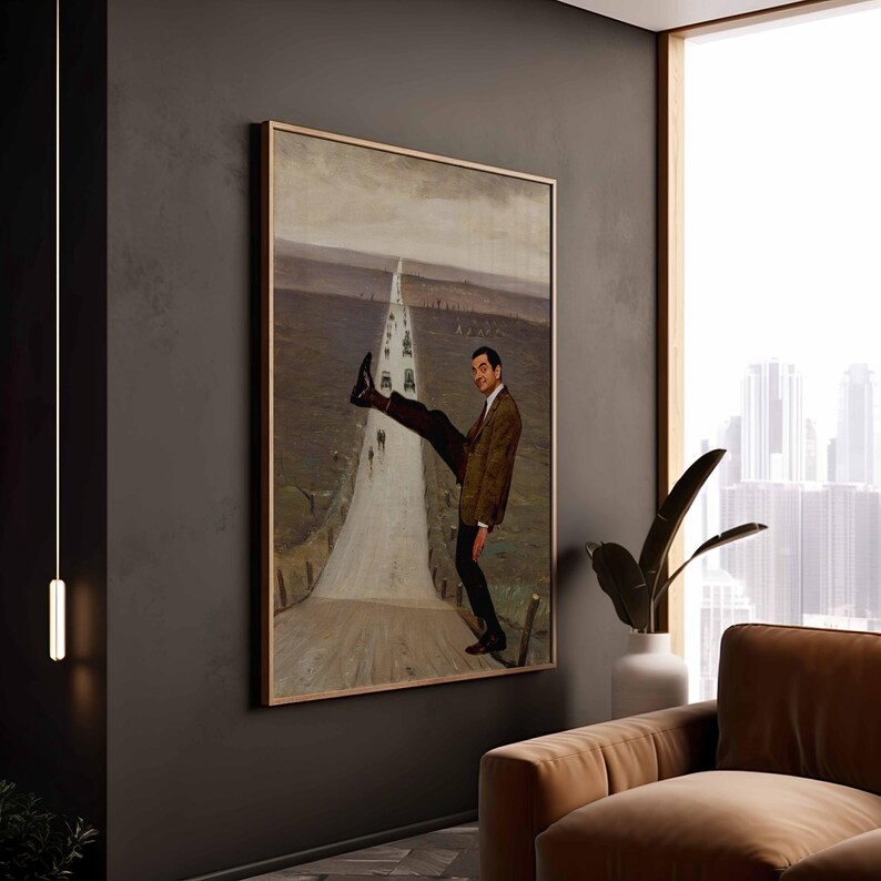 May include: A framed wall art print featuring a man in a brown tweed jacket and black trousers standing on a road, lifting one leg high in the air. The background depicts a long, narrow road stretching into a muted, overcast landscape with distant figures.