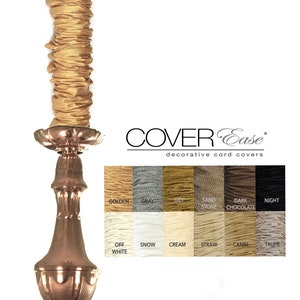 May include: A gold-coloured metal chandelier with a decorative cord cover. The cord cover is available in a variety of colours, including golden, grey, gilt, sand stone, dark chocolate, night, off white, snow, cream, straw, camel, and taupe. COVER Ease decorative cord covers.