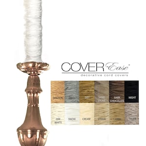 Peut inclure: Un lustre décoratif avec un cache-cordon blanc. L'image présente un nuancier avec des teintes telles que doré, gris et crème. La marque "COVER Ease" est visible, pour les cache-cordons décoratifs.