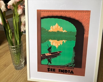 May include: A vintage travel poster advertising "See India" with an illustration of a man in a boat on a lake with a palace reflected in the water. The text "The Chhattar Manzil, Lucknow" is at the bottom of the poster.