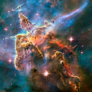 May include: A vibrant nebula with swirling clouds of gas and dust in shades of blue, orange, and red.  The nebula is illuminated by bright stars, creating a celestial landscape.