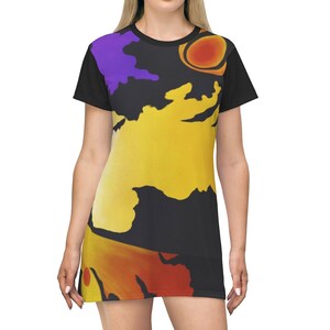 May include: A black t-shirt dress with a colorful abstract design featuring yellow, orange, red, and purple shapes.