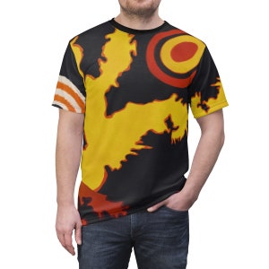 May include: A black t-shirt with a colorful abstract design featuring yellow, red, and orange shapes. The design resembles a stylized map or landscape.
