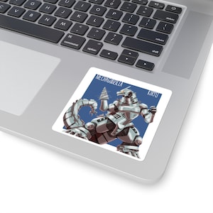 May include: A sticker featuring a white and gray robot monster with a drill on its arm. The robot is standing on a blue background with the text "MECHAGODZILLA" and "KIRYU" in white.